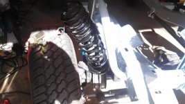 strap to pull springs out allowing frame to drop to install radious arms.jpg
