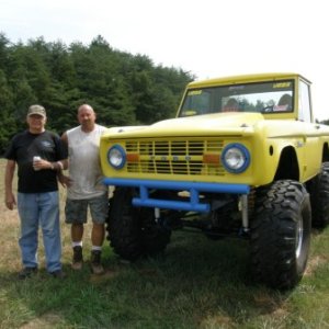My dad and brother standing beside my brother's 77' with 40" swampers.