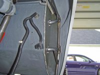 063007 drvr front fender mount through wheelwell rear strut.JPG