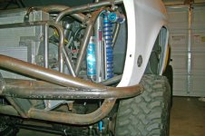 060108 Front shock stack through grille.jpg
