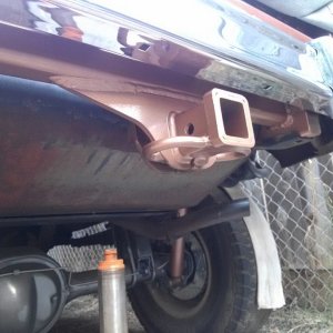 Rear custom hitch with stock chrome bumper overlay