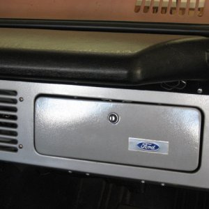 New glove box door, covered holes with Ford emblem