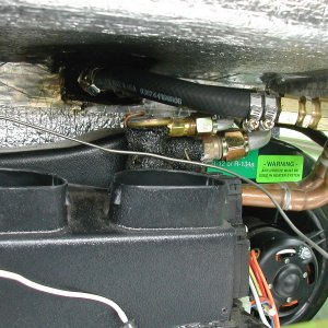 Heater hoses routed